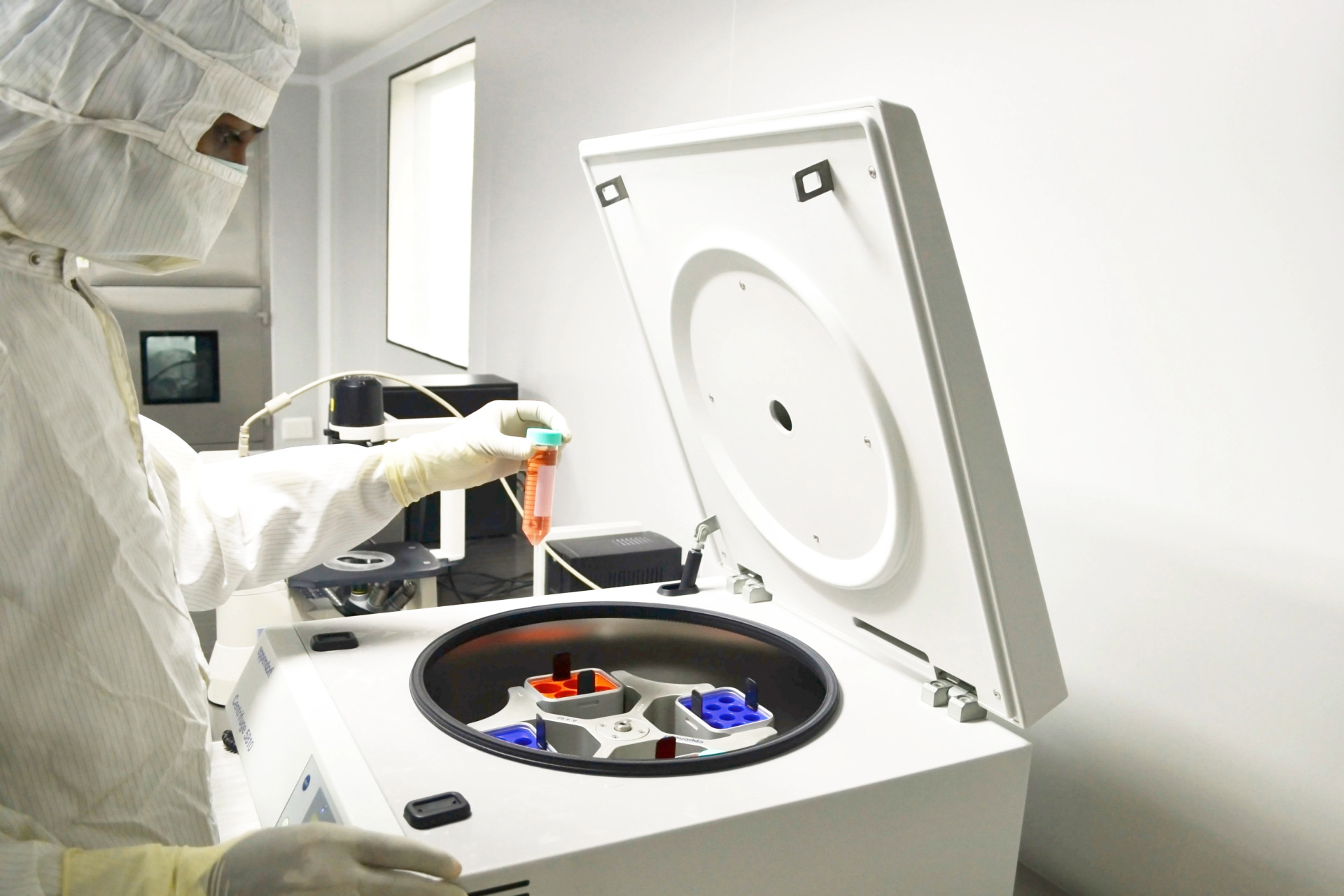 Technician operating stainless steel process equipment in a pharmaceutical or chemical plant, illustrating cleanroom-compatible sealing for FFKM o rings.